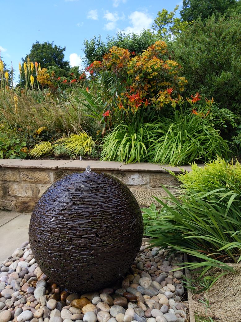 sphere water feature with planting